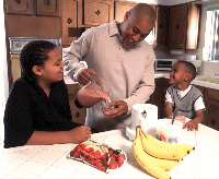 photo of a family having a healthy fruit snack
