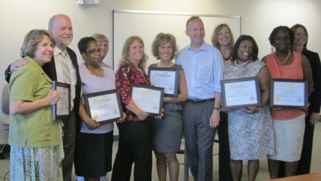 Photo: Division of Services for Aging and Adultswith Physical Disabilities' (DSAAPD) Care Transitions Team being presented with the 2011 Governor'sTeam Excellence Award