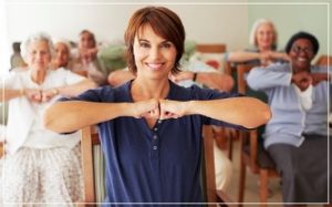 Community Health - short-haired woman leading fitness class